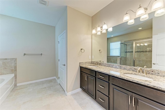 bathroom featuring vanity, plus walk in shower, and tile patterned floors