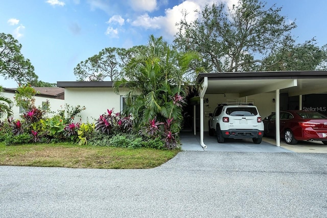 view of parking featuring a carport