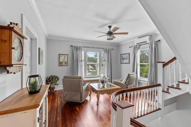 living room featuring ornamental molding, an AC wall unit, ceiling fan, and hardwood / wood-style flooring