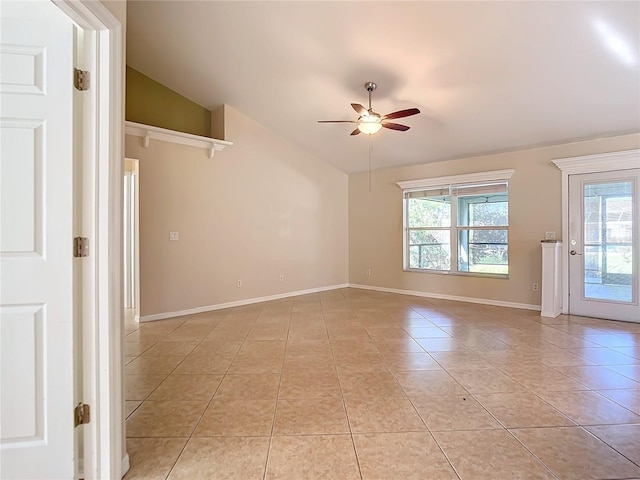 tiled spare room featuring ceiling fan and lofted ceiling