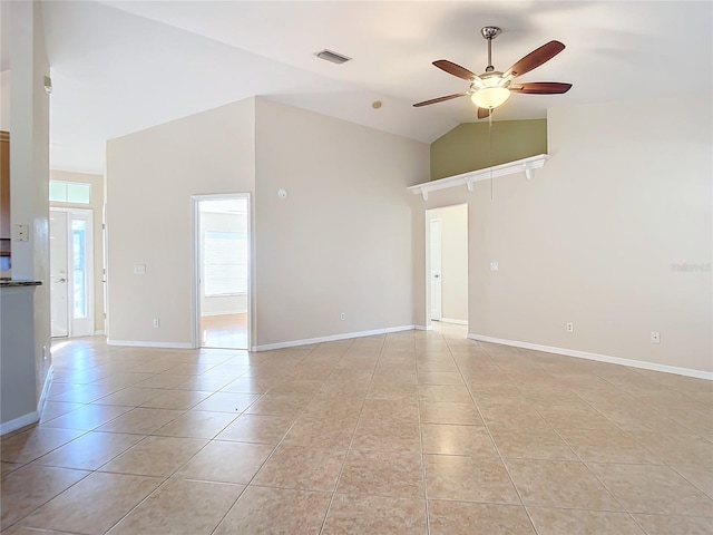 tiled spare room featuring ceiling fan and high vaulted ceiling