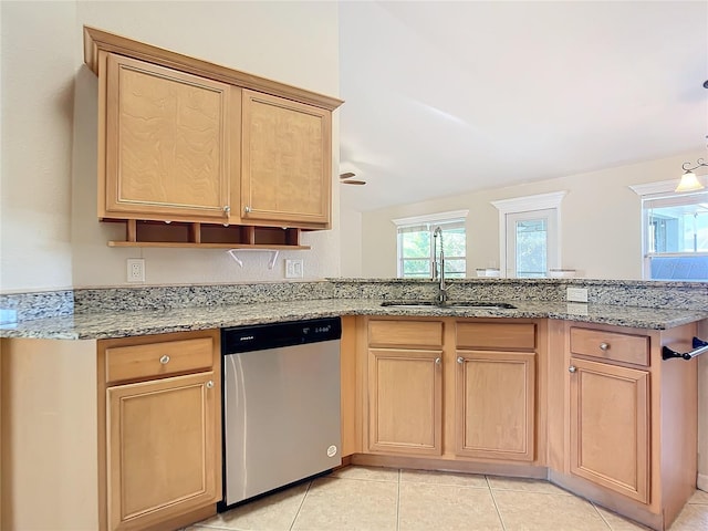 kitchen with light tile patterned flooring, light stone counters, dishwasher, ceiling fan, and sink