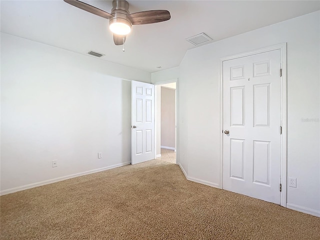 unfurnished bedroom with ceiling fan and light carpet