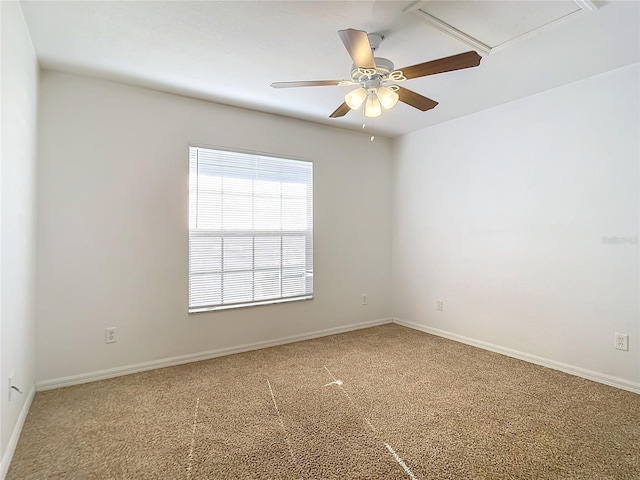 carpeted empty room featuring ceiling fan