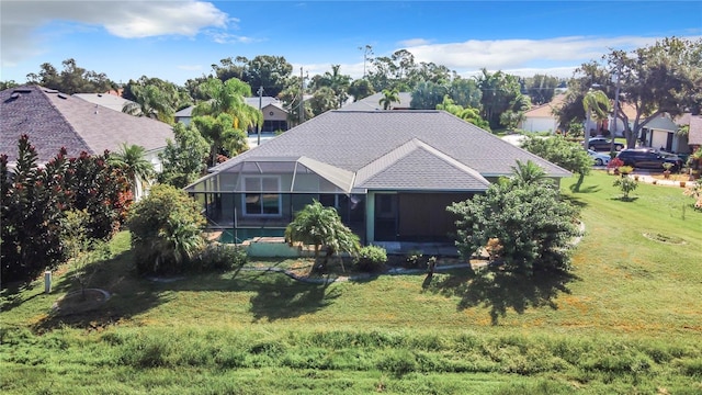 view of front of home with a lanai and a front yard