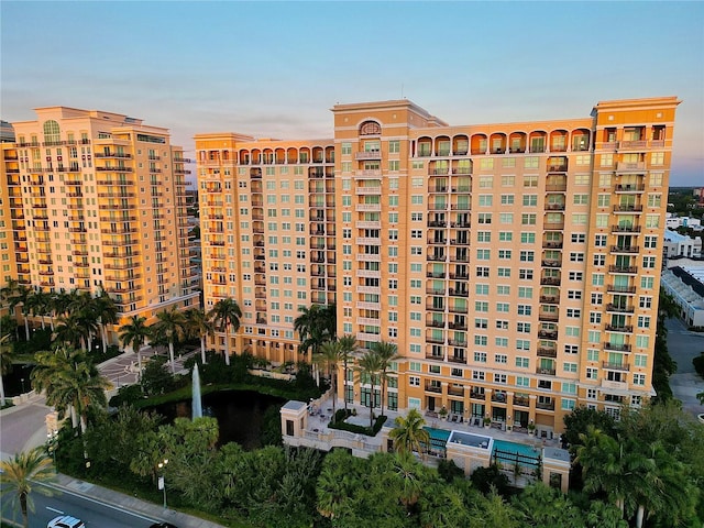 view of outdoor building at dusk