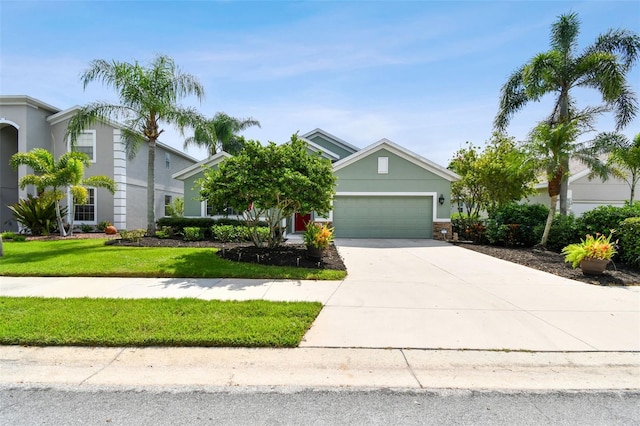 view of front facade with a front lawn and a garage