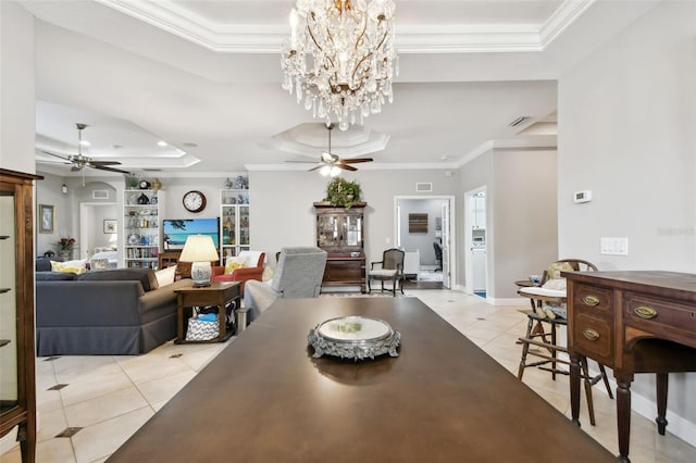 dining room with light tile patterned floors, ceiling fan with notable chandelier, crown molding, and a raised ceiling