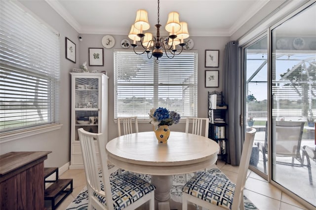 tiled dining area featuring a notable chandelier and ornamental molding