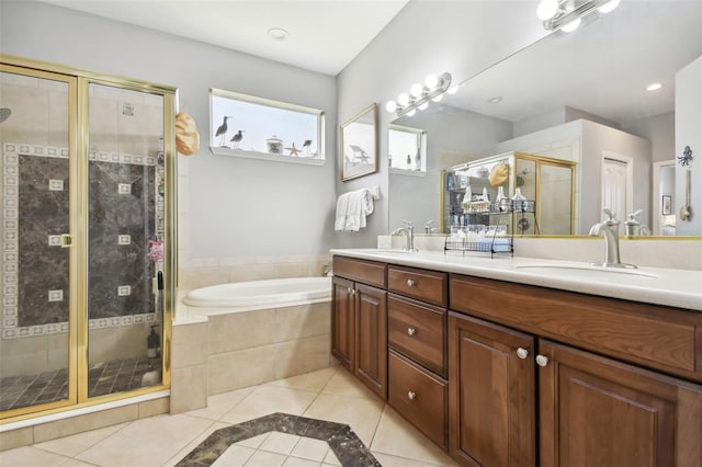 bathroom featuring vanity, plus walk in shower, and tile patterned flooring