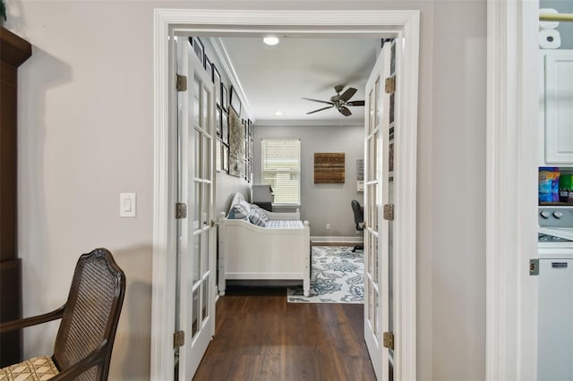 interior space with dark wood-type flooring and crown molding