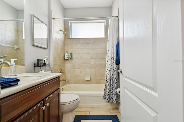 full bathroom featuring tile patterned flooring, vanity, toilet, and shower / bathtub combination with curtain