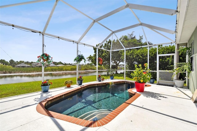 view of swimming pool with a water view, glass enclosure, and a patio