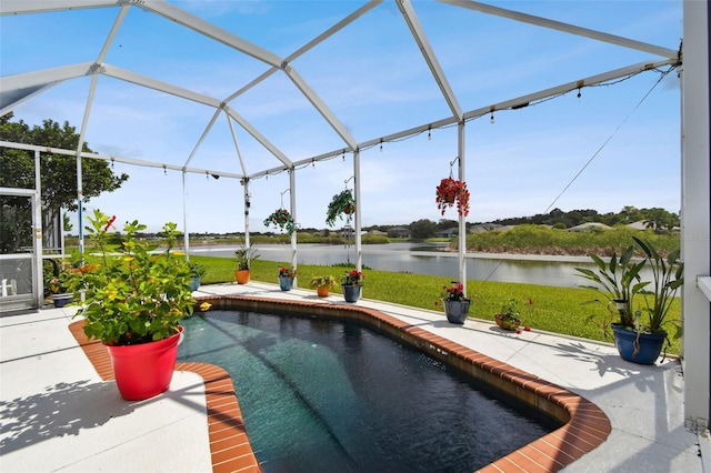 view of pool featuring a water view, a patio, and a lanai