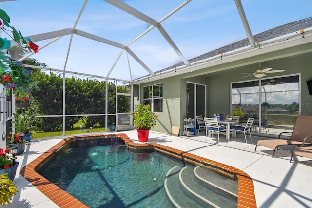 view of pool featuring a lanai, ceiling fan, and a patio area