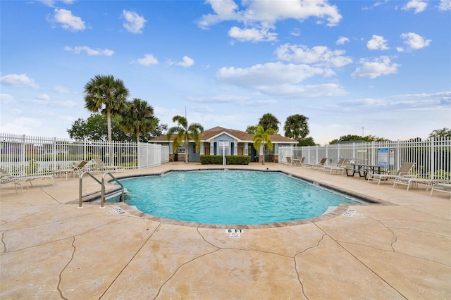 view of swimming pool with a patio area