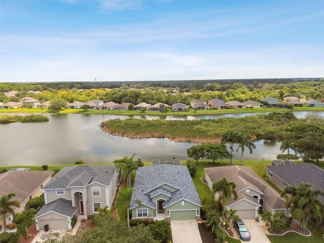 birds eye view of property with a water view