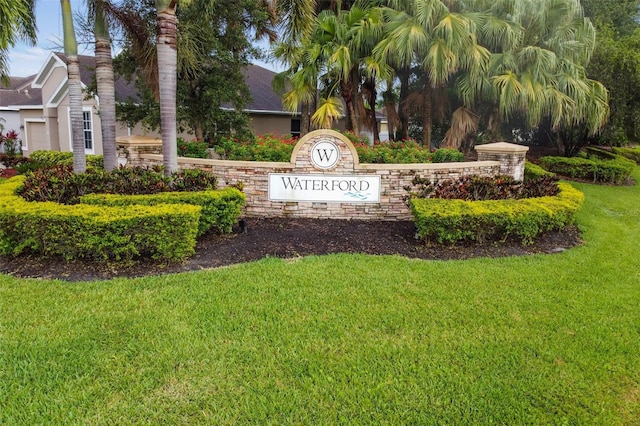 community / neighborhood sign with a lawn