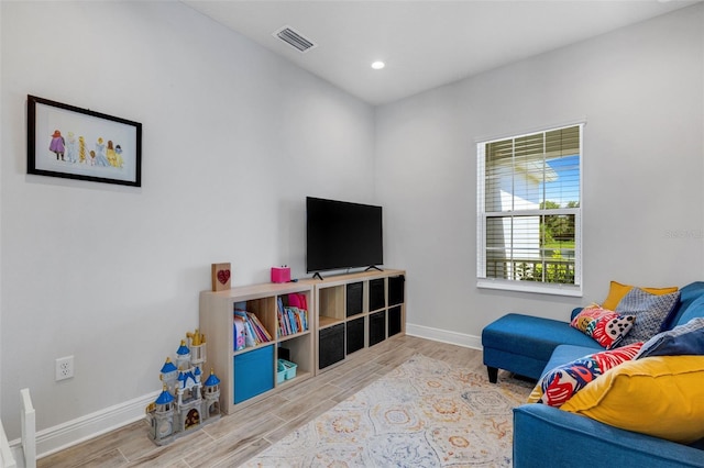 recreation room with hardwood / wood-style flooring