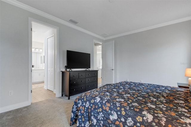 bedroom featuring ornamental molding, light carpet, and connected bathroom