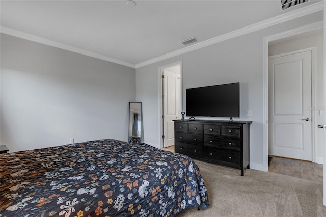 bedroom featuring crown molding and light carpet