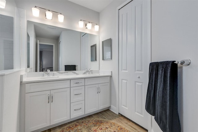 bathroom featuring vanity and wood-type flooring