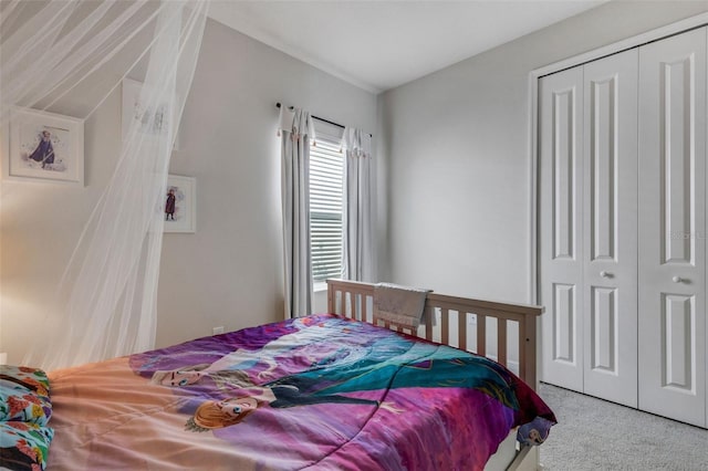 carpeted bedroom featuring a closet