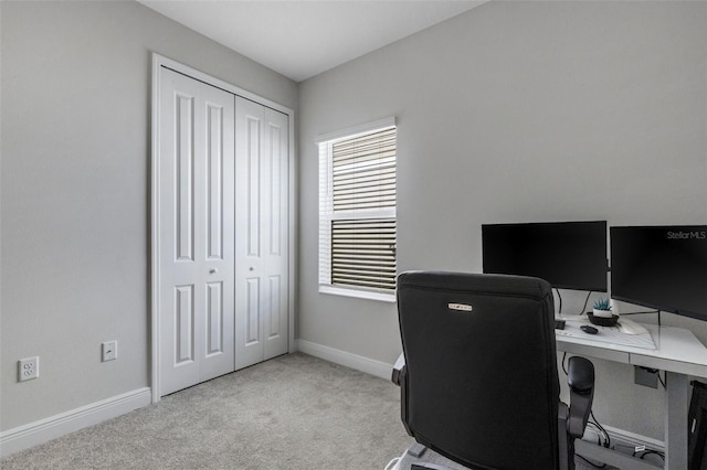 carpeted home office with baseboards