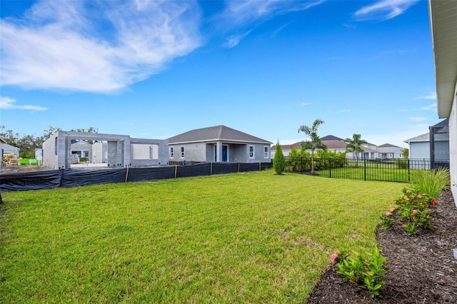 view of yard with a residential view and fence