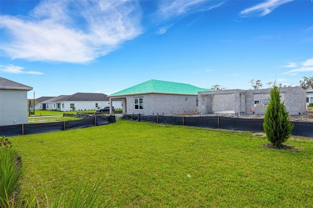 view of yard with a residential view and fence