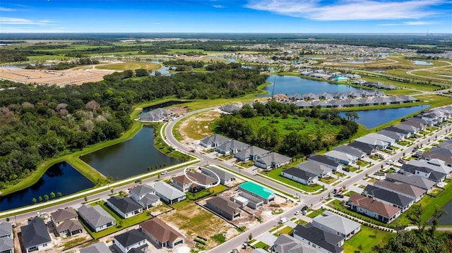 birds eye view of property featuring a residential view and a water view