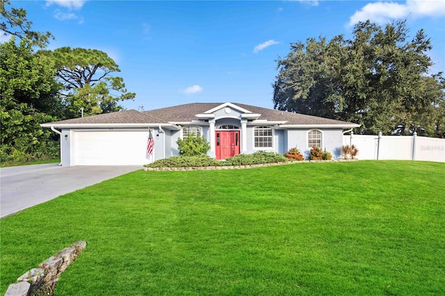 ranch-style home featuring a garage and a front yard