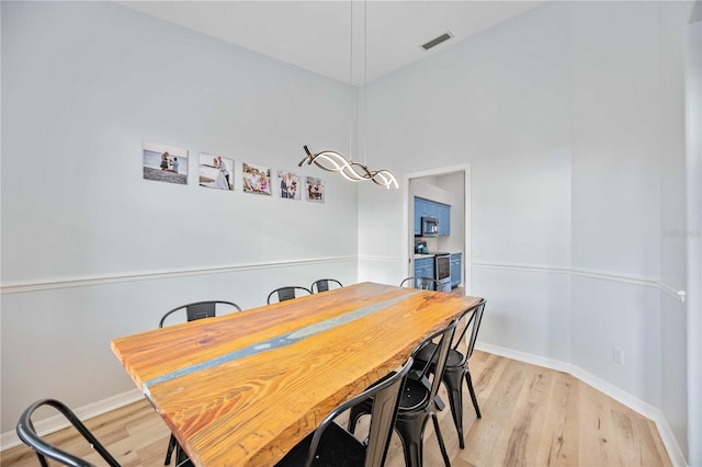 dining room featuring light hardwood / wood-style flooring