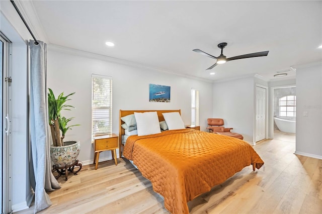 bedroom with light wood-type flooring, crown molding, ceiling fan, and multiple windows