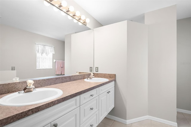 bathroom featuring tile patterned flooring and vanity