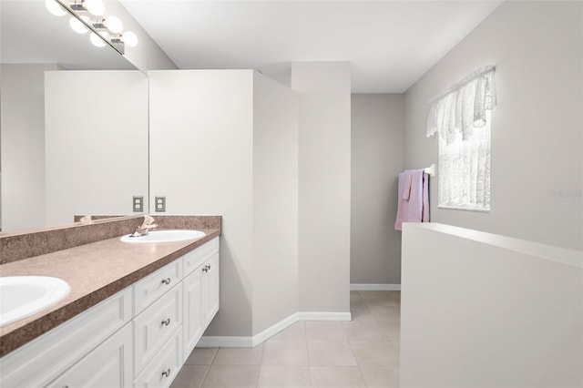 bathroom featuring tile patterned flooring and vanity