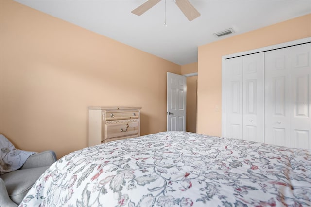 bedroom featuring ceiling fan and a closet