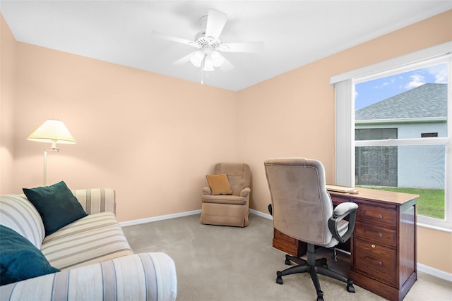 office area featuring ceiling fan, light colored carpet, and a wealth of natural light