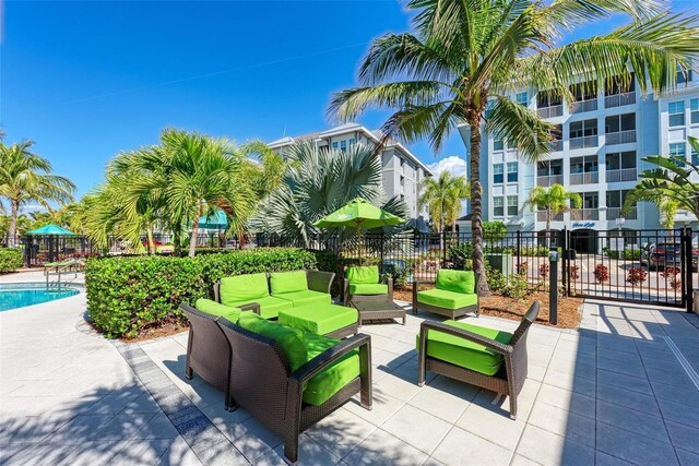 view of community featuring outdoor lounge area and a pool