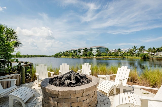 view of patio / terrace featuring a water view and an outdoor fire pit