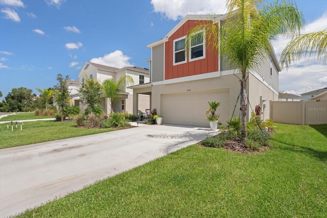 view of front of house featuring a front lawn and a garage