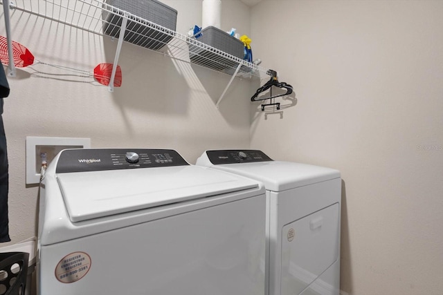 laundry area featuring washing machine and clothes dryer