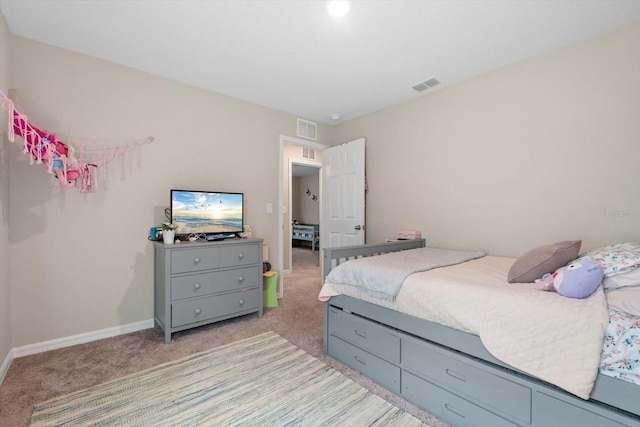 bedroom featuring light carpet