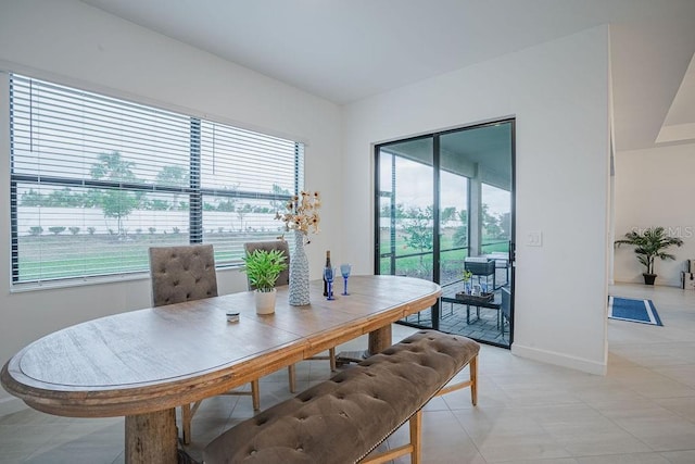 dining space with light tile patterned flooring