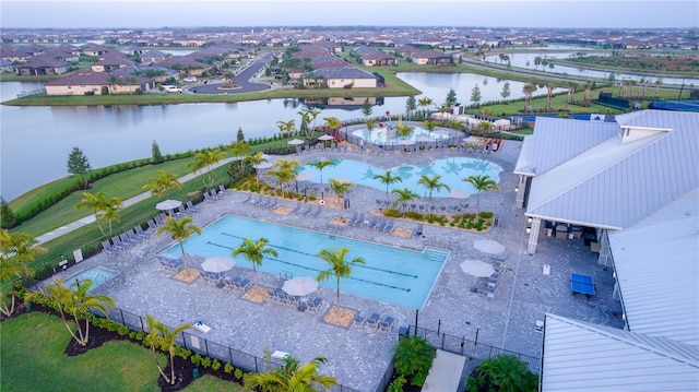 birds eye view of property featuring a water view