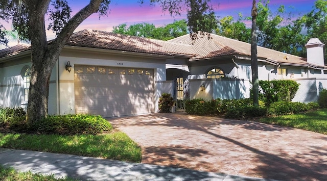 mediterranean / spanish-style house featuring a garage