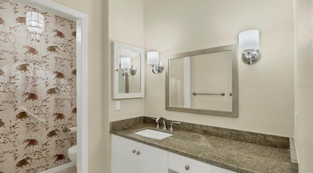 bathroom with vanity and toilet