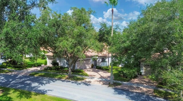 obstructed view of property featuring a garage