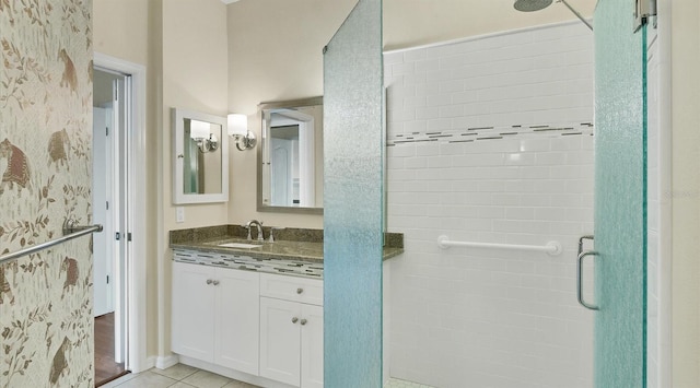 bathroom featuring vanity, tile patterned floors, and an enclosed shower