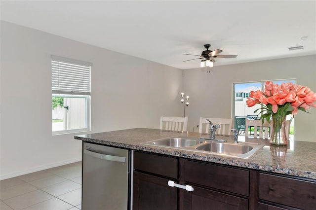 kitchen with light tile patterned flooring, ceiling fan, dark brown cabinetry, stainless steel dishwasher, and sink